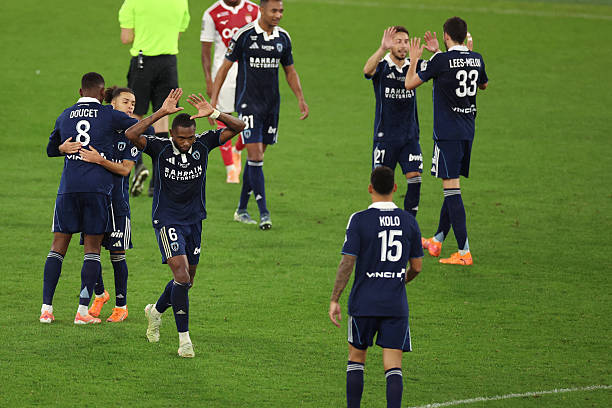 Paris FC's players celebrate at the end of the French L1 football match between AS Monaco and Paris FC at the Louis II Stadium (Stade Louis II) in the Principality of Monaco on November 1, 2025. (Photo by Valery HACHE / AFP) (Photo by VALERY HACHE/AFP via Getty Images)